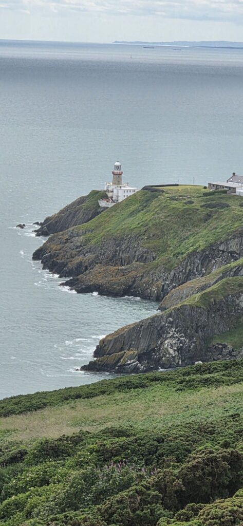 Lighthouse on a green headland, Ireland, 2025