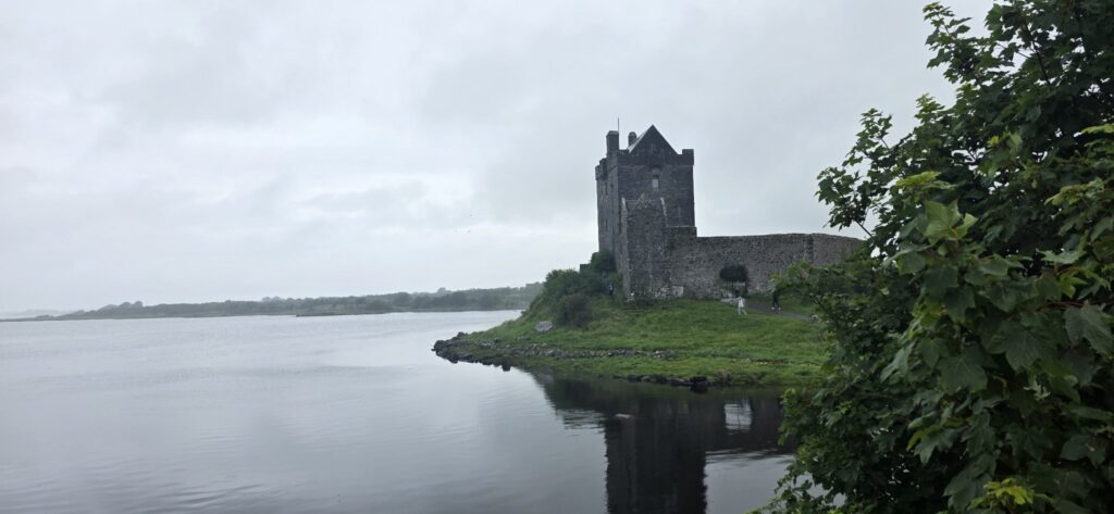 Castle tower over still water, Ireland, 2025