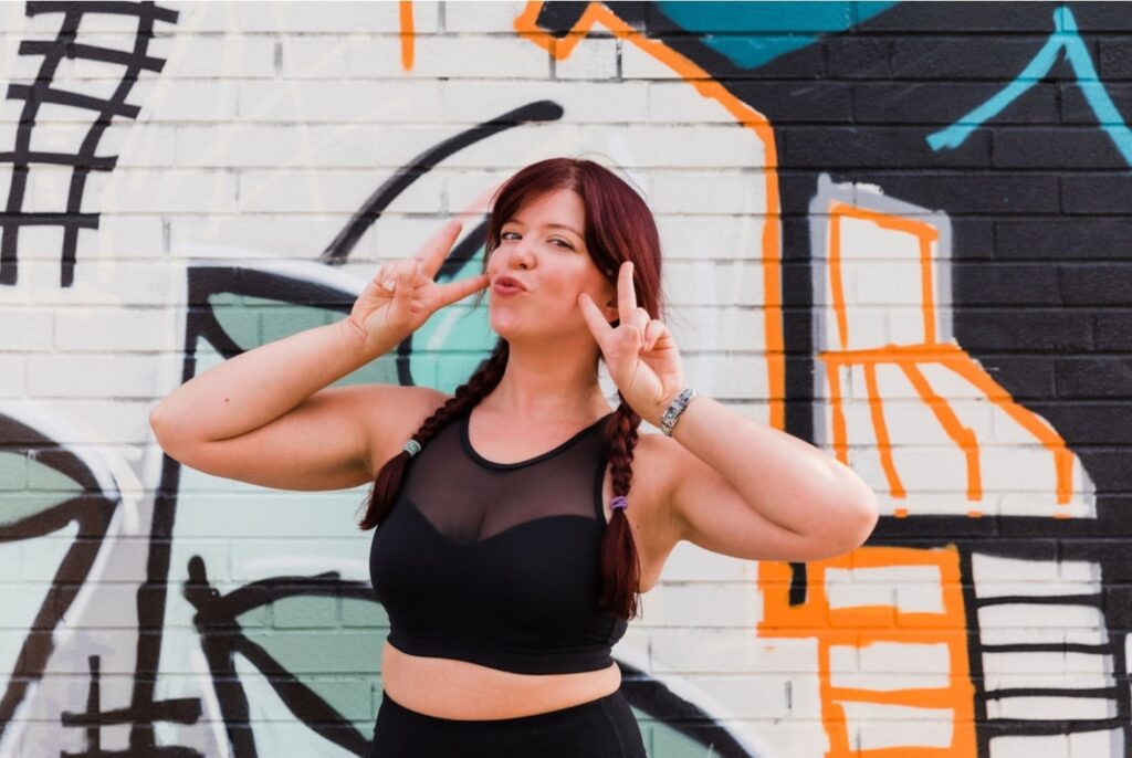 Peace signs at the graffiti wall, Vibe photoshoot, 2021
